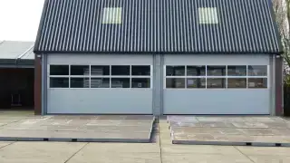 Modern warehouse exterior illustrating commercial property valuation and insurance replacement cost