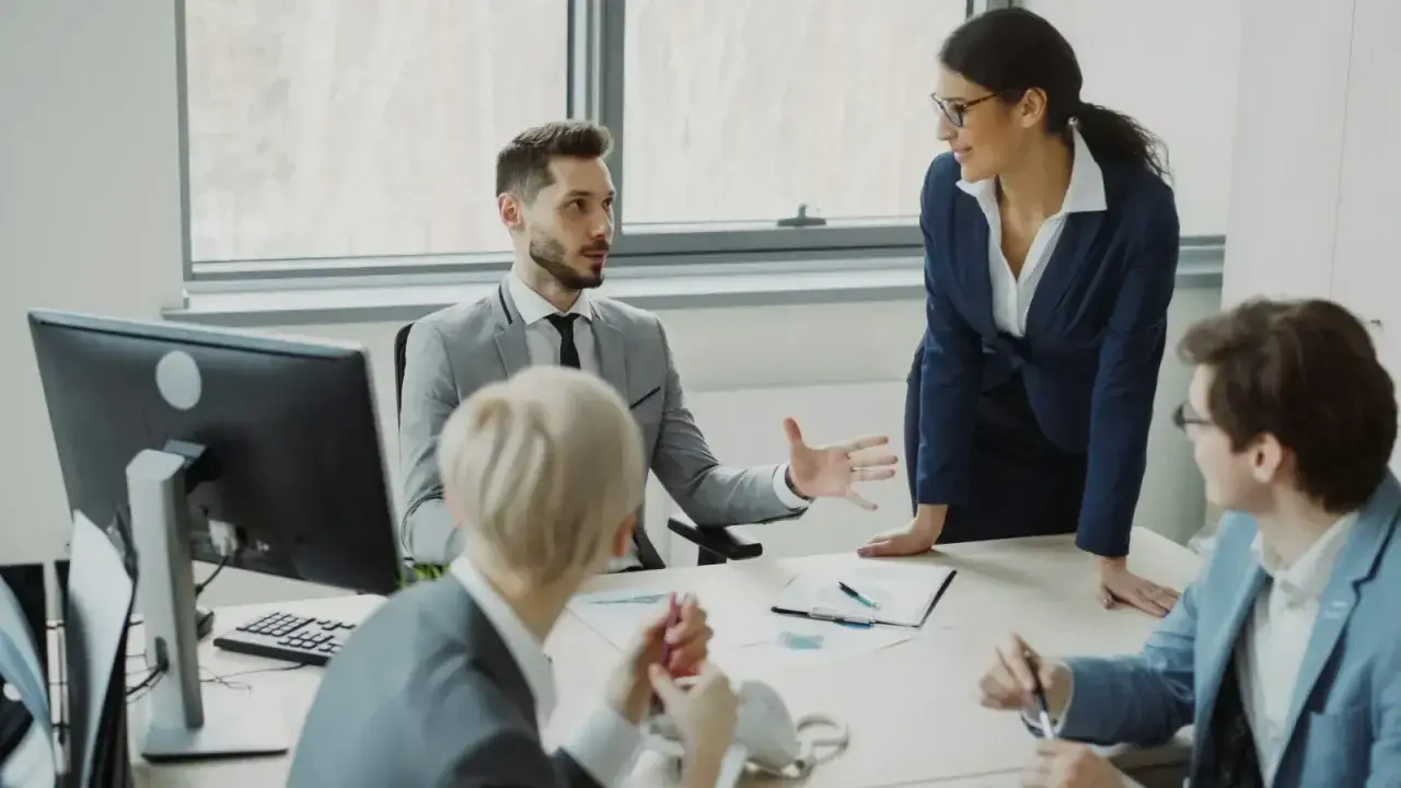 Corporate professionals reviewing business information, illustrating captive insurance and enterprise risk financing
