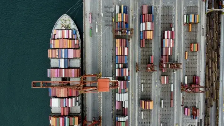 Container ship at a global port illustrating marine cargo insurance and supply-chain risk
