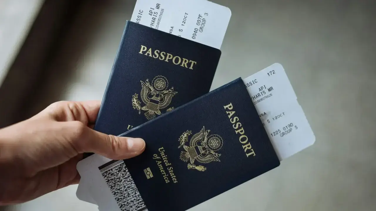 U.S. passports with boarding passes, illustrating travel insurance and medical coverage questions before an international trip