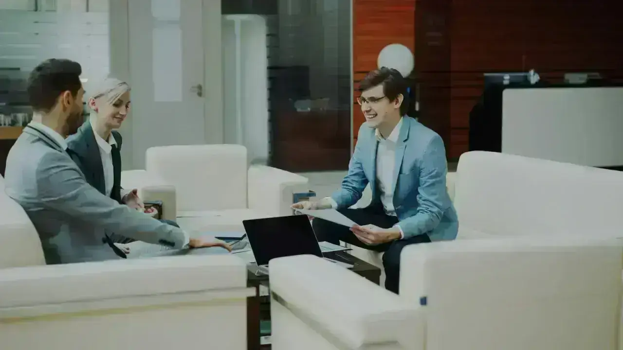 Business partners discussing financial reports in a modern office
