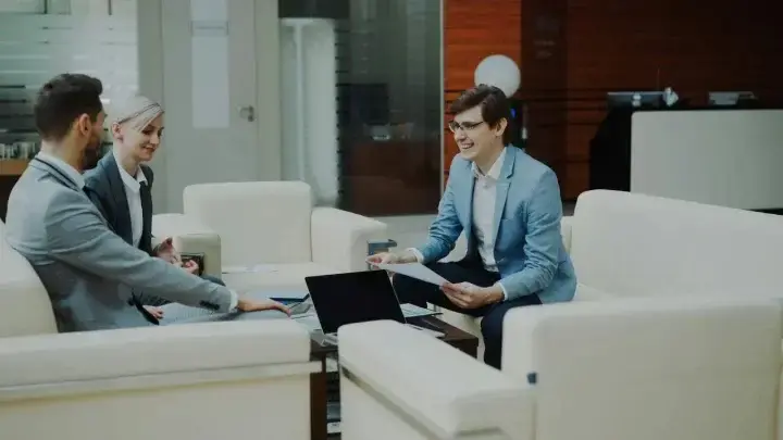 Business partners discussing financial reports in a modern office
