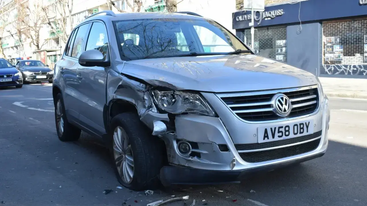 Damaged car after a road collision, illustrating uninsured and underinsured motorist coverage
