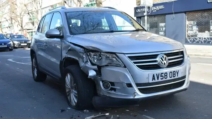 Damaged car after a road collision, illustrating uninsured and underinsured motorist coverage