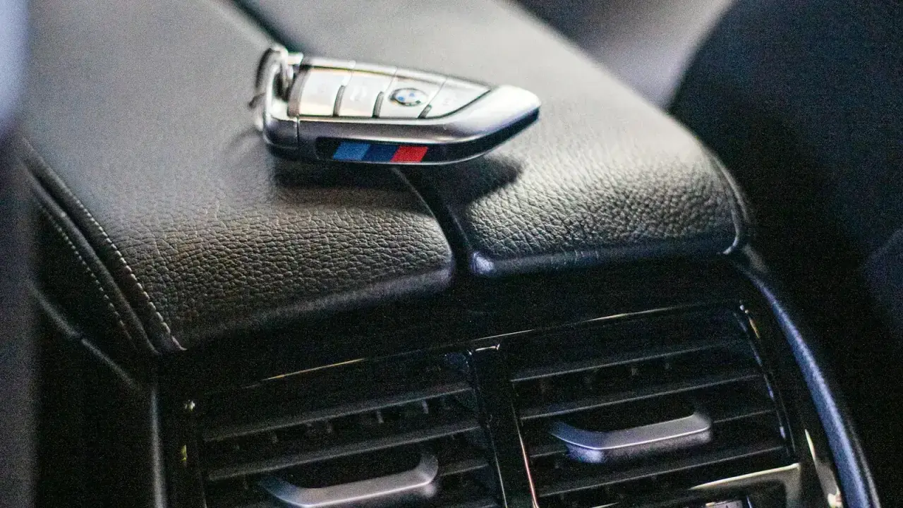 Car key resting inside a vehicle illustrating the choice between $500 and $1,000 auto insurance deductibles