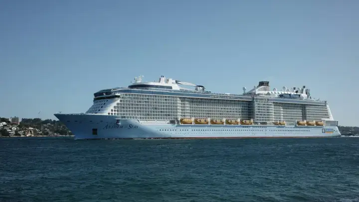 Large cruise ship sailing on the ocean for a cruise travel insurance guide