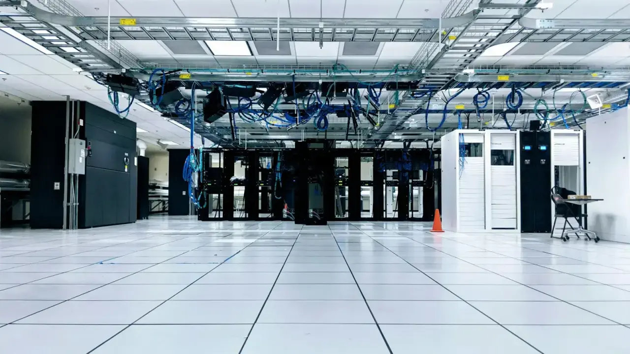 Data-center server racks and network infrastructure, illustrating third-party technology vendor and cyber supply-chain risk