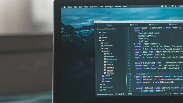 Laptop displaying source code, illustrating forensic investigation and cyber data-breach response