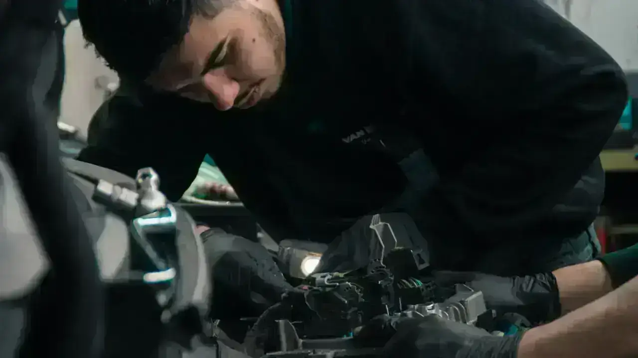 Automotive repair shop scene illustrating vehicle repairs and diminished value after an accident