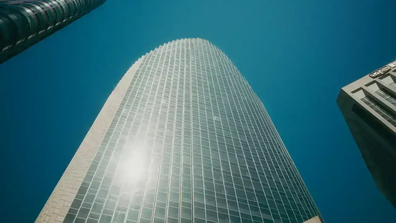 Financial district skyline illustrating global insurance balance sheets and excess of loss reinsurance capacity