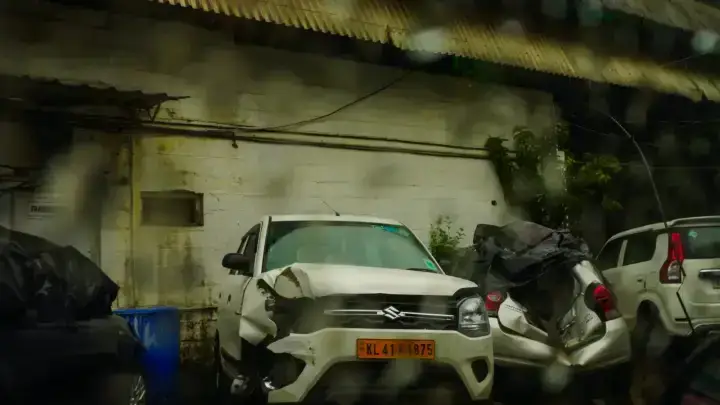 Damaged cars after a collision on a rainy street illustrating a hit-and-run auto insurance claim