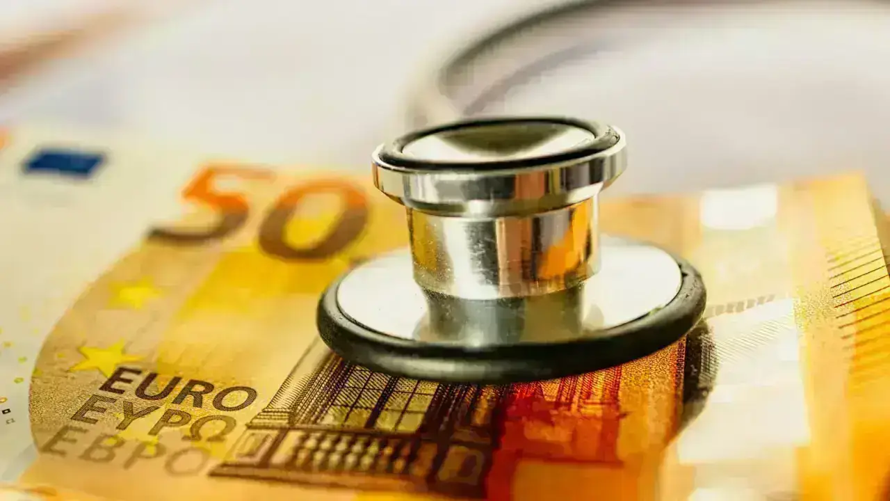 Stethoscope resting on a stack of money, illustrating tax-favored accounts used to pay qualified health care expenses