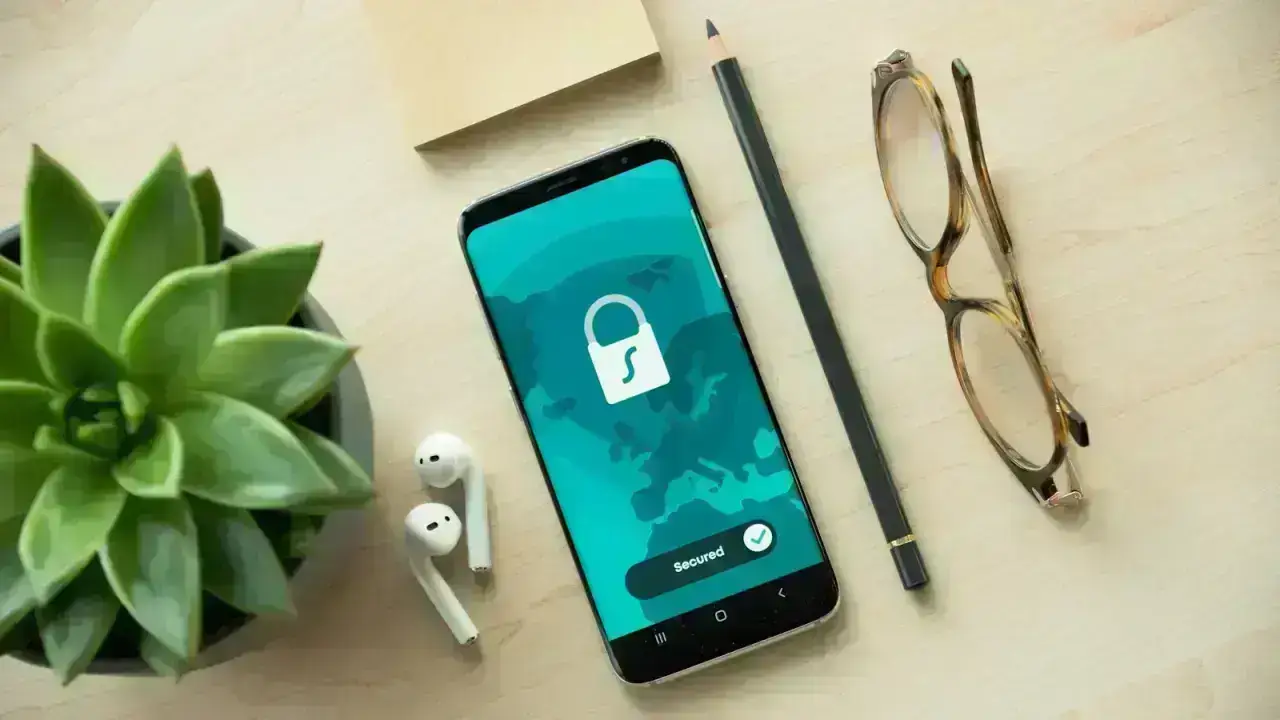 Smartphone with security lock illustrating identity theft insurance and identity recovery steps