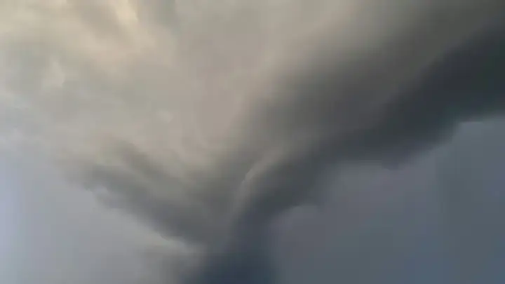 Severe storm clouds crossing a landscape, illustrating catastrophe aggregation under a reinsurance hours clause