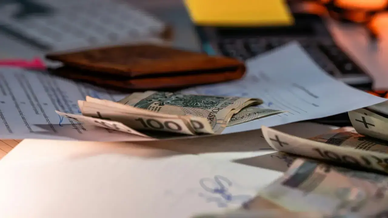 Financial documents and money on a desk illustrating insurer regulatory capital and solvency analysis