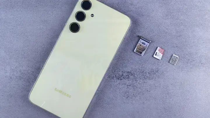Smartphone with SIM cards illustrating SIM swap fraud and personal cyber insurance response