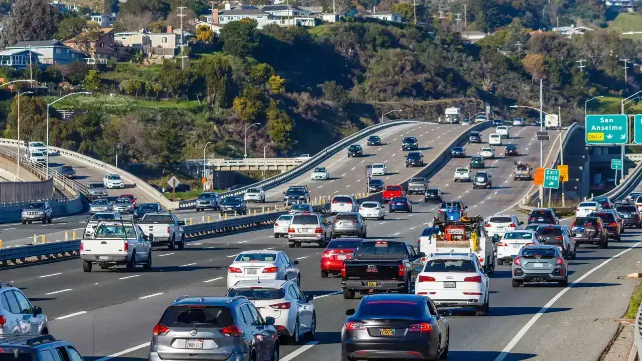 Cars traveling on a multilane highway illustrating auto liability insurance limits and accident exposure