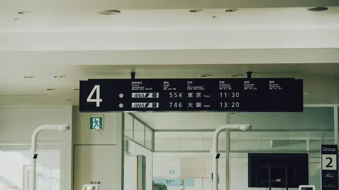 Airport departure board with flight information, illustrating travel supplier financial default and trip disruption risk