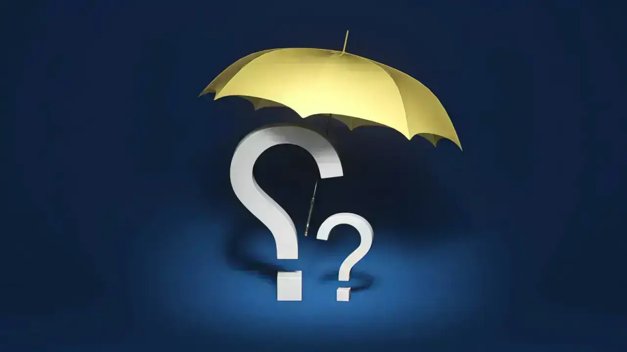 Insurance protection concept with an umbrella and question marks, illustrating disputed claim handling