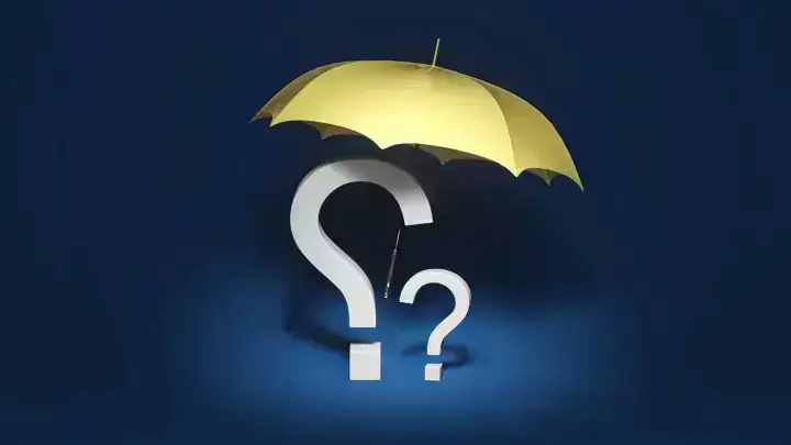 Insurance protection concept with an umbrella and question marks, illustrating disputed claim handling