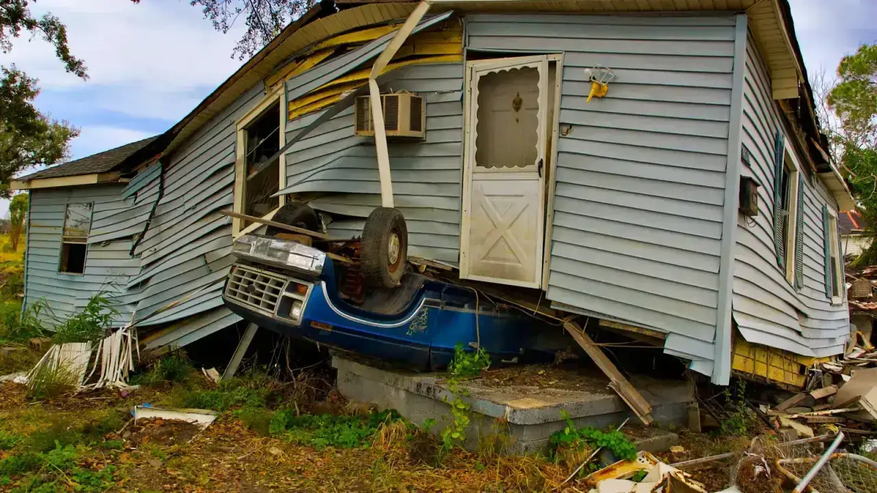 Damaged residential property after a severe event, illustrating catastrophe risk transferred through reinsurance