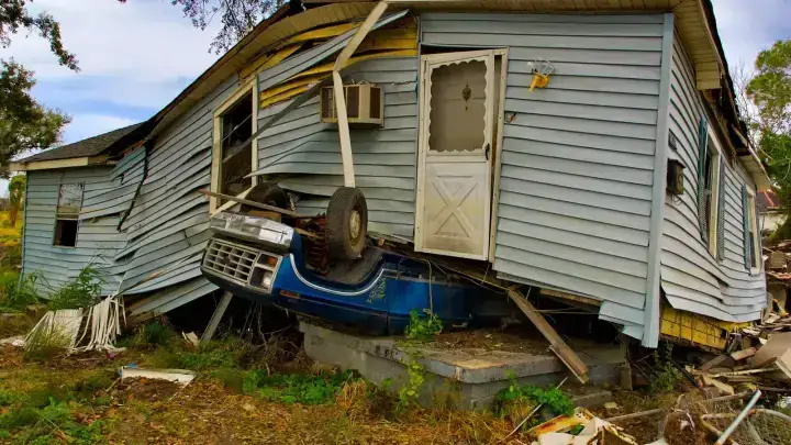 Damaged residential property after a severe event, illustrating catastrophe risk transferred through reinsurance
